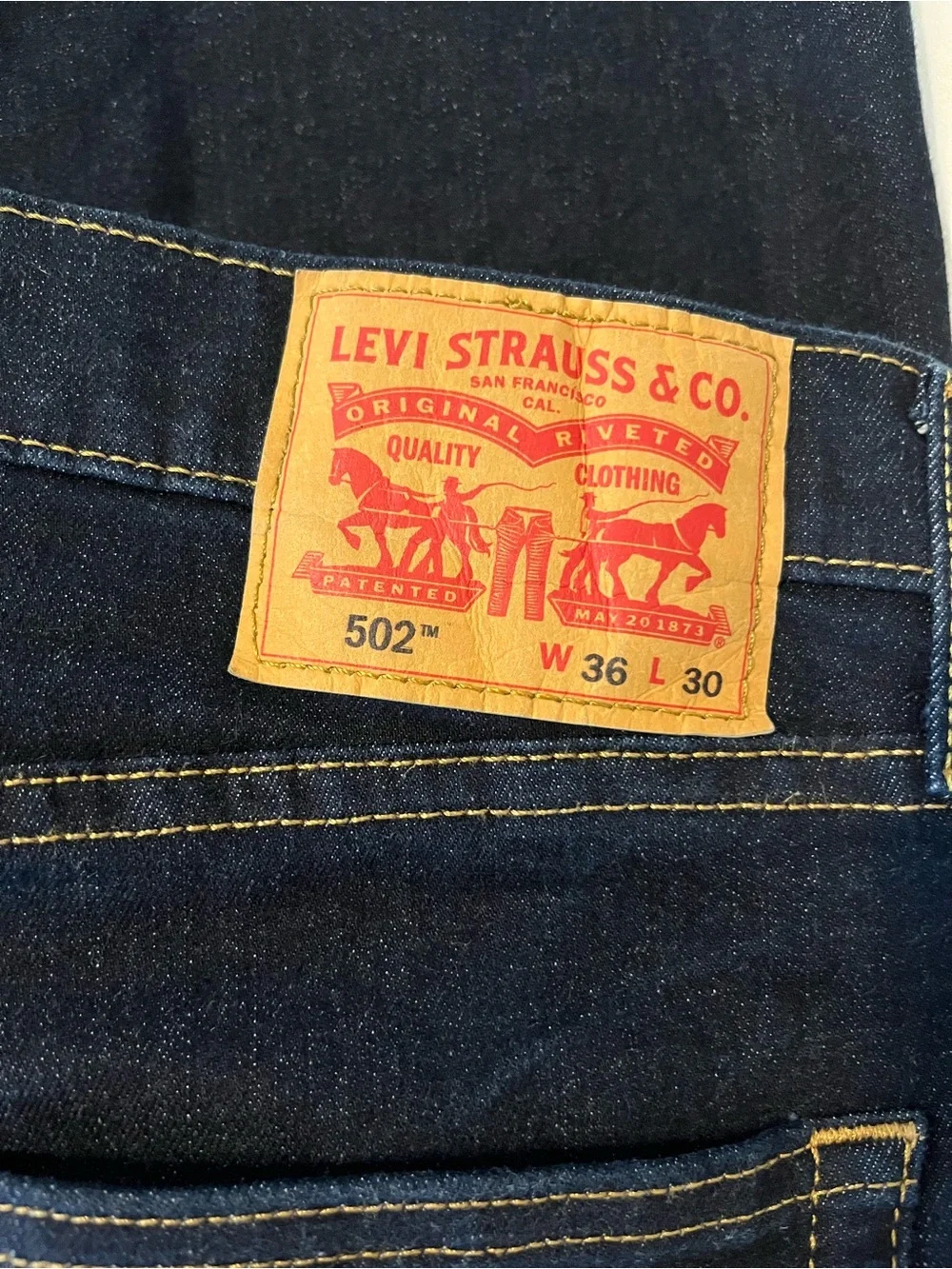 Levi's Men's Jeans in Dark Indigo with Tan Patch